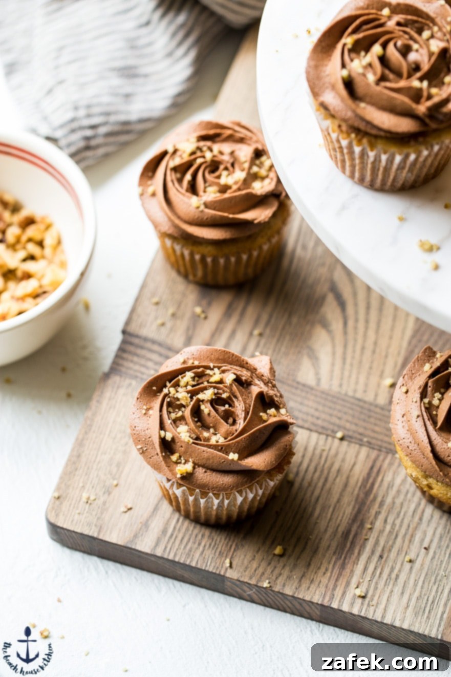 Choco-Banana Bliss Cupcakes 2 Overhead photo of banana cupcakes with chocolate buttercream on a wooden board