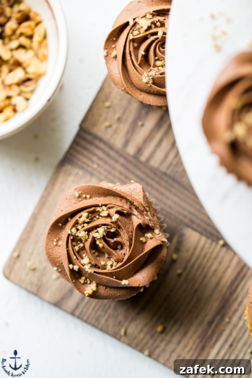 Choco-Banana Bliss Cupcakes 3 Overhead photo of banana cupcakes with chocolate buttercream on a wooden board