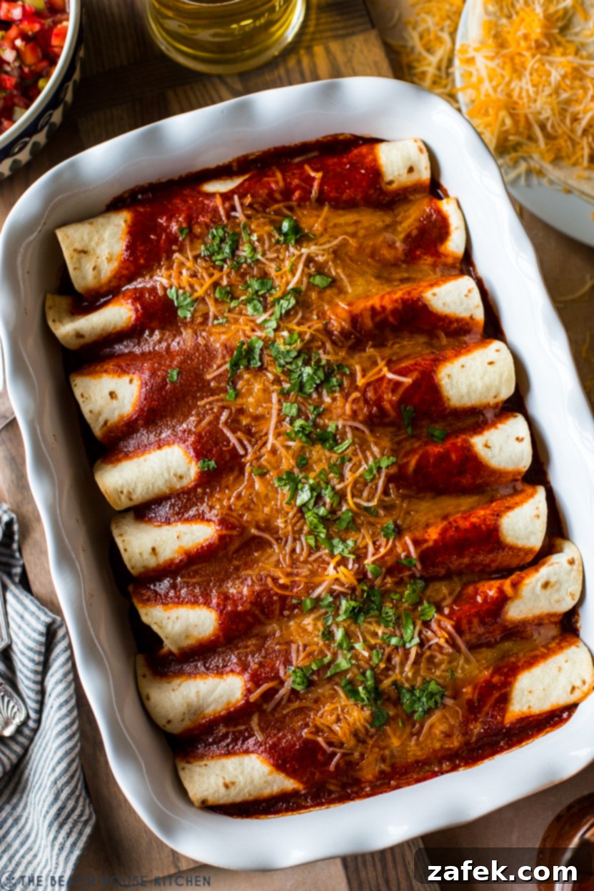 Effortless Homemade Beef Enchiladas 2 Up close overhead photo of a pan of easy homemade beef enchiladas