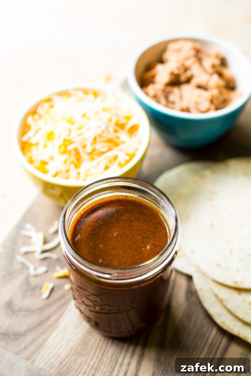 Effortless Homemade Beef Enchiladas 4 Up close photo of a jar of homemade enchilada sauce