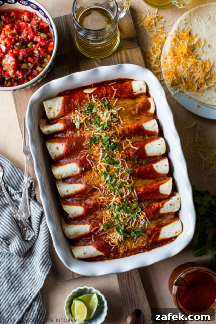 Effortless Homemade Beef Enchiladas 8 Overhead photo of a pan of baked beef enchiladas