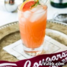 The Charleston Sparkle 7 A refreshing Charleston Fizz Cocktail with a lime slice.