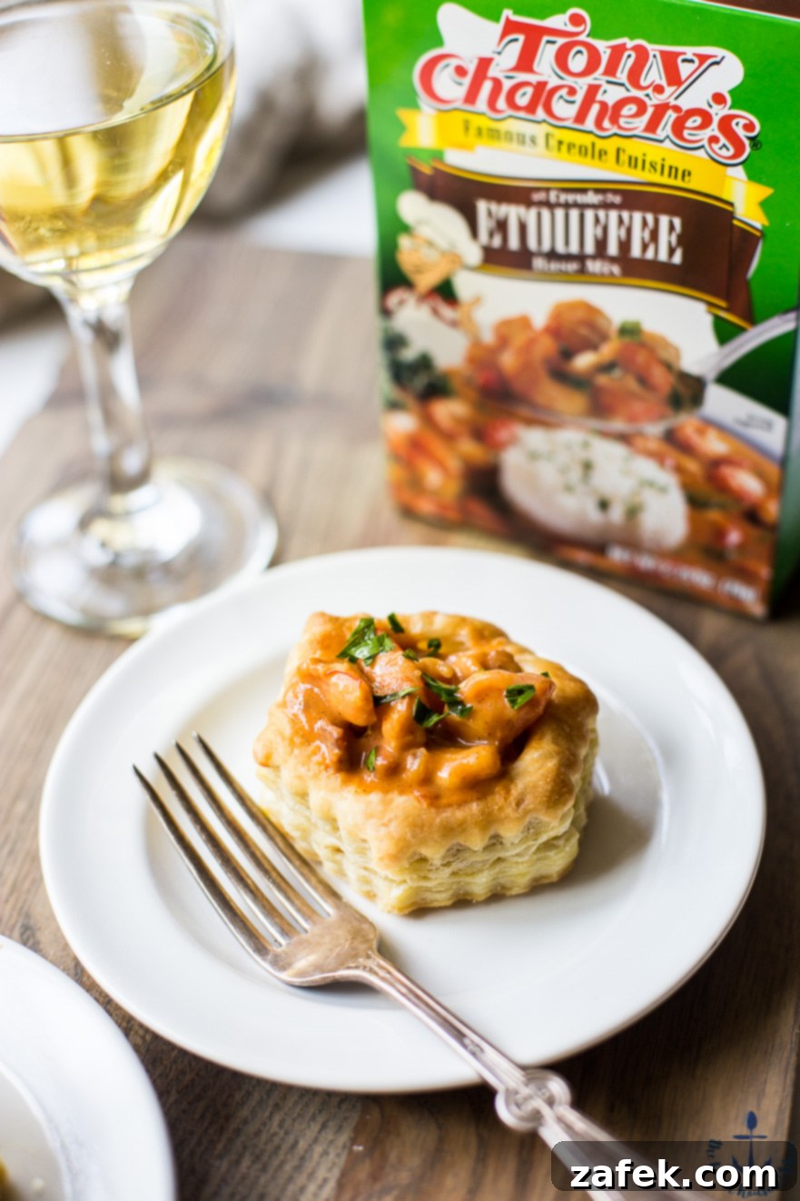 Louisiana Etouffee Shrimp Puffs 6 Photo of a shrimp etouffee vol au vent on a white plate with a fork