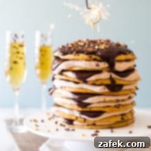 Armenian Honey Cake 11 An 8 layer Armenian layer cake on a cake plate with two glasses of champagne