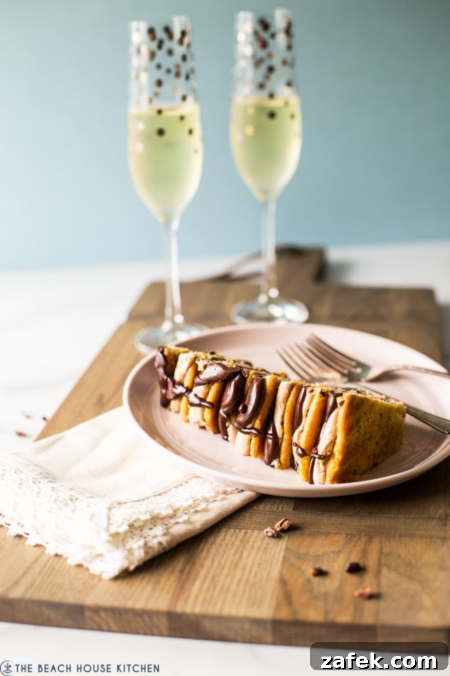 Armenian Honey Cake 3 A perfectly sliced eight-layer Armenian-style layer cake on a plate, showcasing its intricate layers, accompanied by two champagne glasses