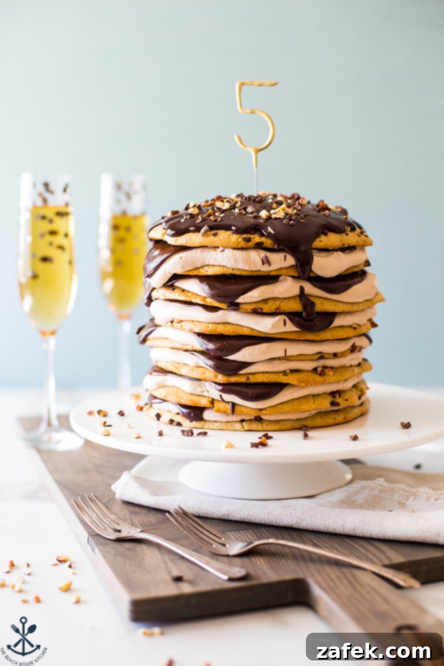 Armenian Honey Cake 8 The grand Armenian-style layer cake standing tall on a cake plate, flanked by two celebratory champagne glasses, ready to be served