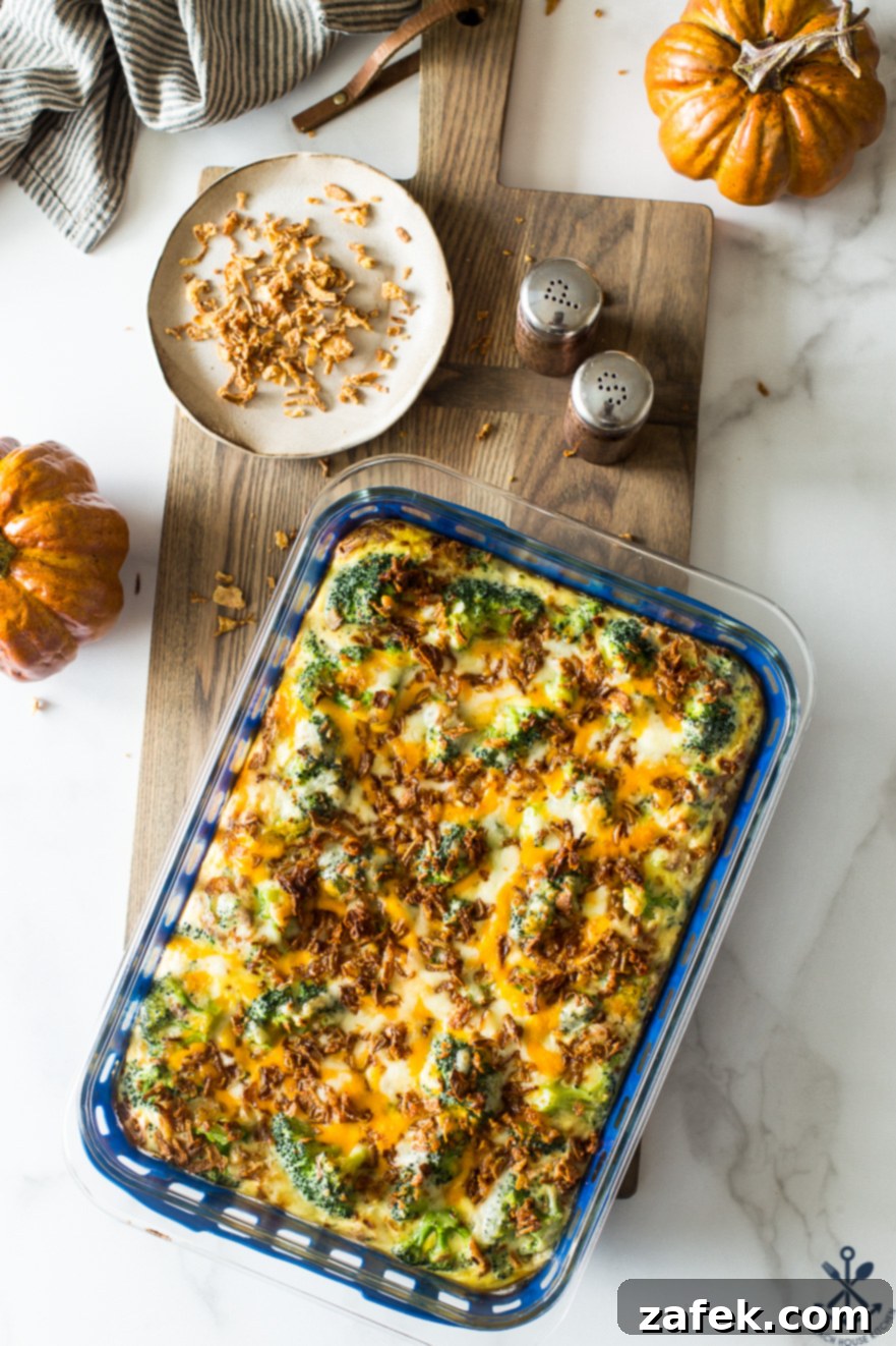 Effortless Festive Broccoli Bake 2 Overhead photo of easy holiday broccoli casserole on a wooden board