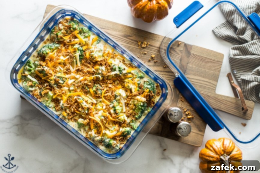 Effortless Festive Broccoli Bake 4 Overhead photo of prebaked easy holiday broccoli casserole on a wooden board