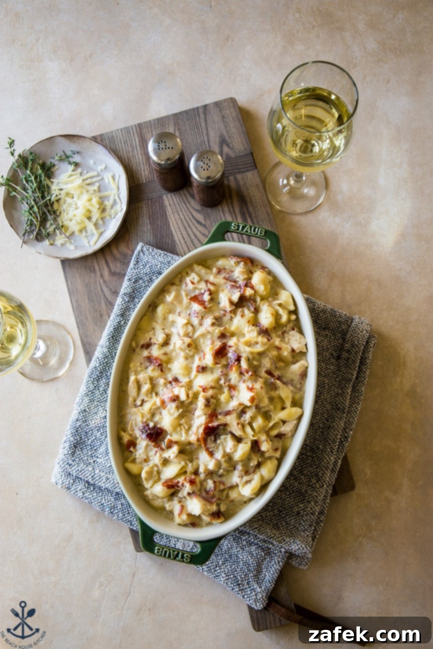 Creamy Cordon Bleu Chicken Pasta Bake 3 Close-up overhead shot of the baked chicken cordon bleu pasta, showcasing its cheesy, golden crust and creamy interior.