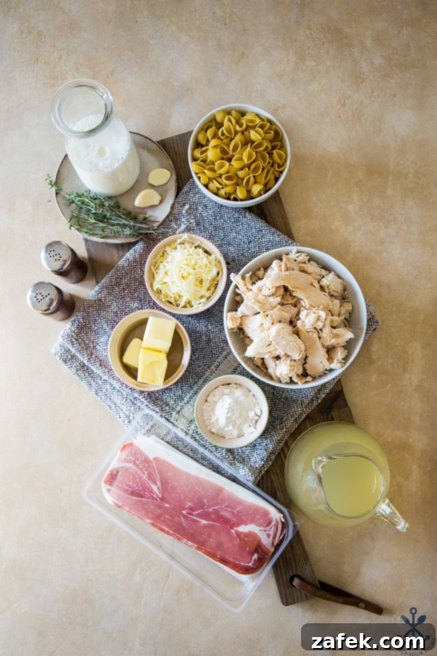 Creamy Cordon Bleu Chicken Pasta Bake 8 Bowls filled with the prepared ingredients for chicken cordon bleu pasta bake, including shredded chicken, cheese, and crispy prosciutto.