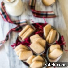 Overhead photo of biscochitos cookies in a round cookie tin