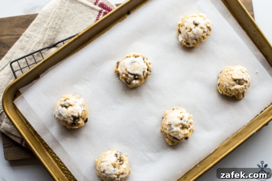 Golden Toasted Coconut Chocolate Chip Scones 6 Overhead view of uncooked chocolate chip toasted coconut scone dough on a baking sheet, ready for the oven