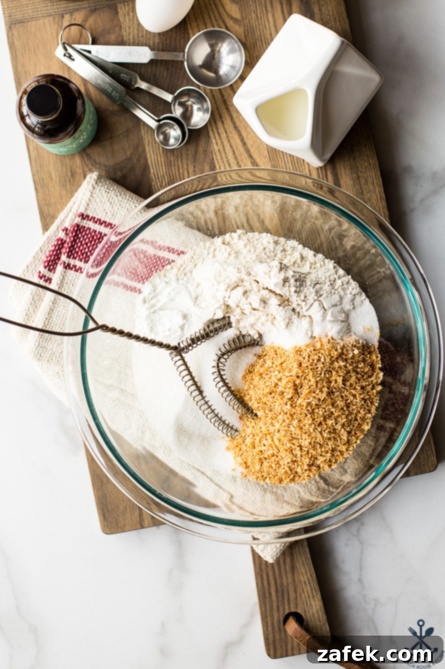 Golden Toasted Coconut Chocolate Chip Scones 8 Overhead photo of fresh ingredients for chocolate chip coconut scones laid out on a rustic wooden board