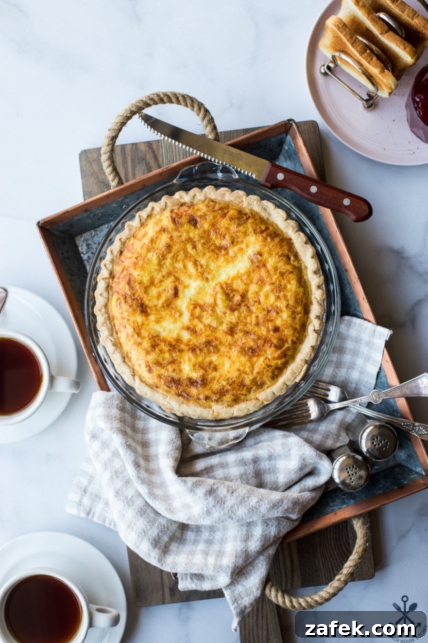 A close-up shot of a slice of Quiche Lorraine, showcasing its creamy texture and crispy bacon bits