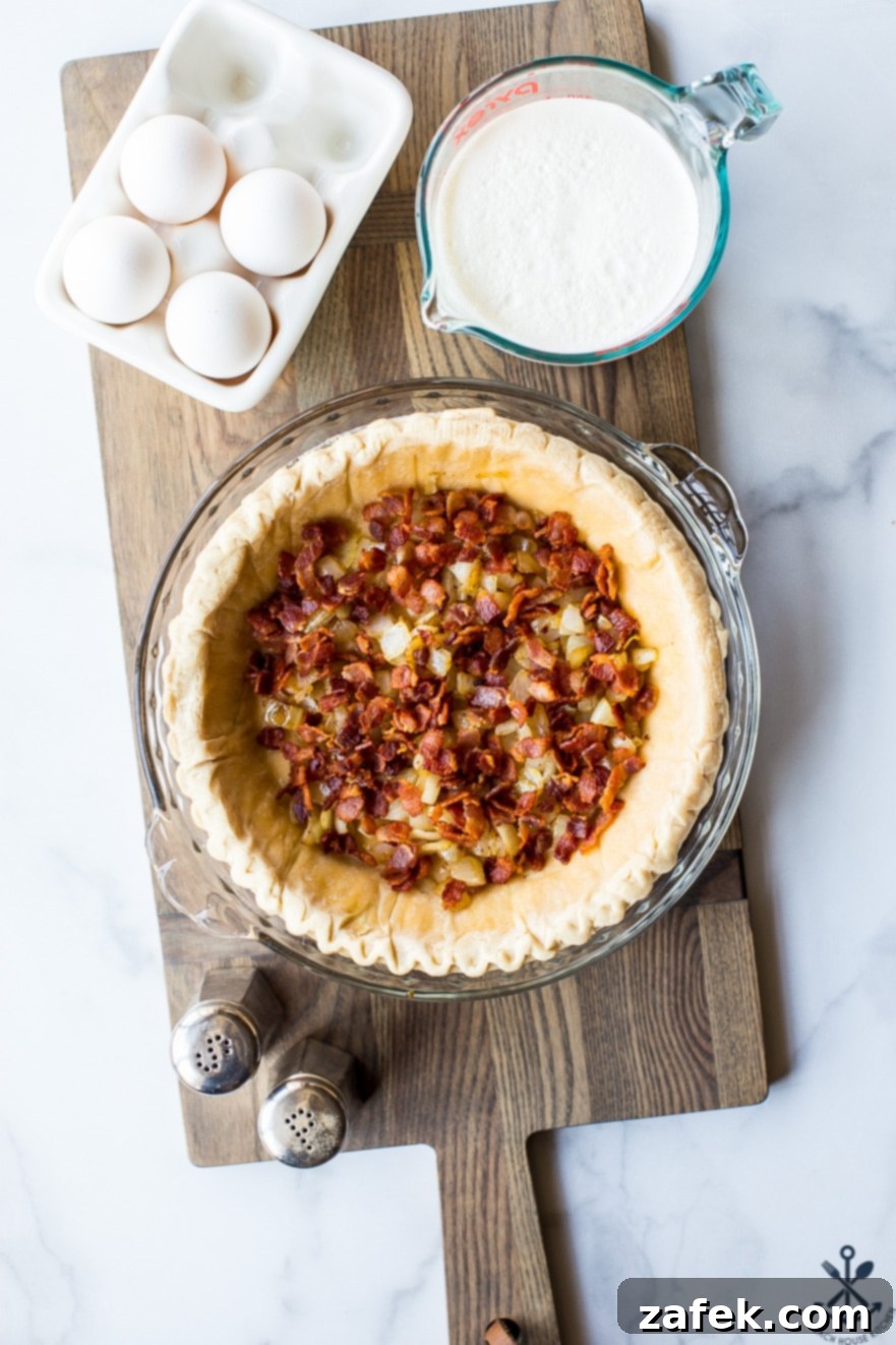A beautifully golden-brown Quiche Lorraine cooling on a wire rack, ready to be sliced