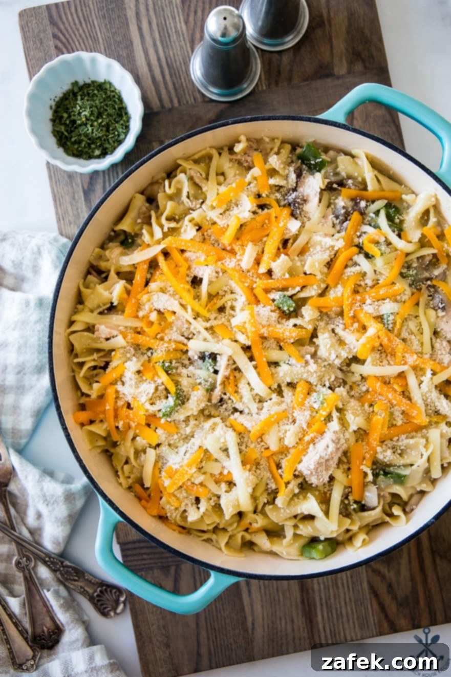 Creamy Tuna Noodle Delight 6 A close-up of the crispy, golden-brown cheese topping on the tuna noodle casserole.