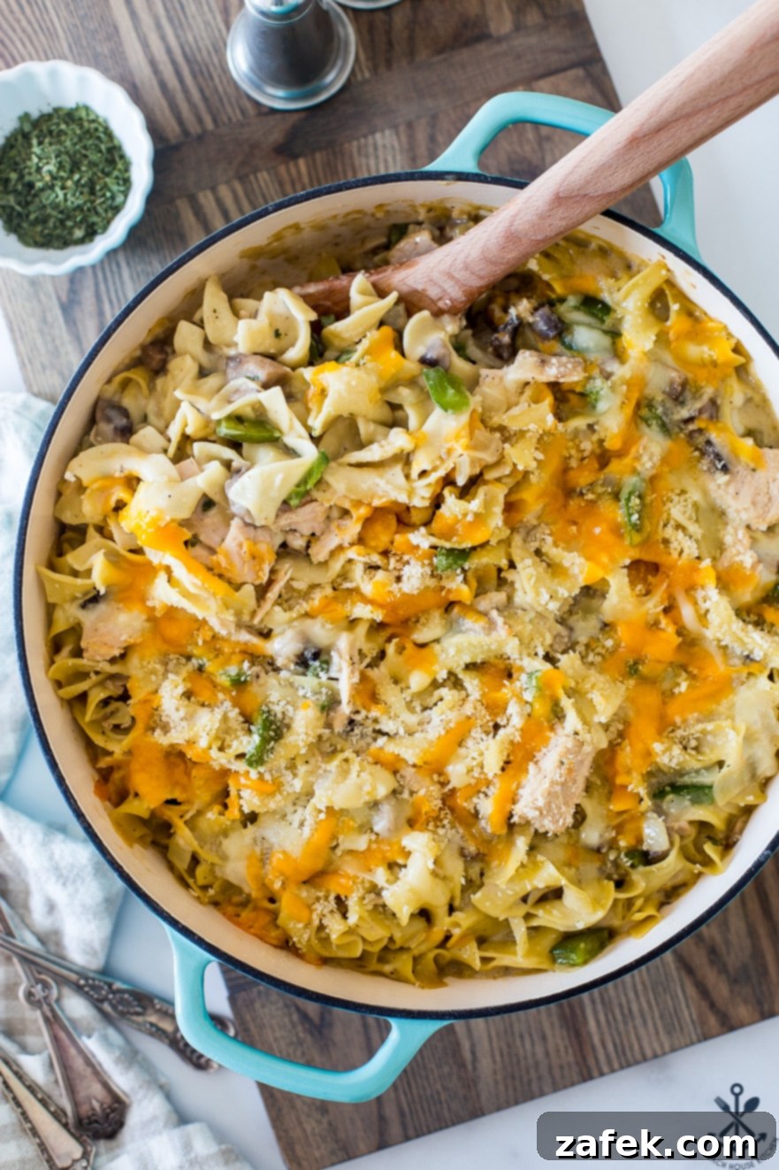 Creamy Tuna Noodle Delight 7 The finished tuna noodle casserole, served in a skillet, ready to be enjoyed.