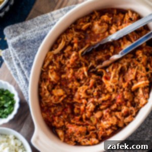 Slow Cooker Chicken Tinga with fresh cilantro and lime
