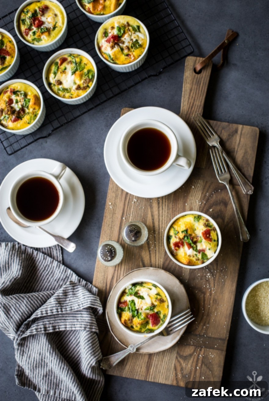 Overhead shot of freshly baked egg cups arranged on a wooden board, accompanied by two steaming cups of coffee, highlighting a cozy and inviting breakfast scene