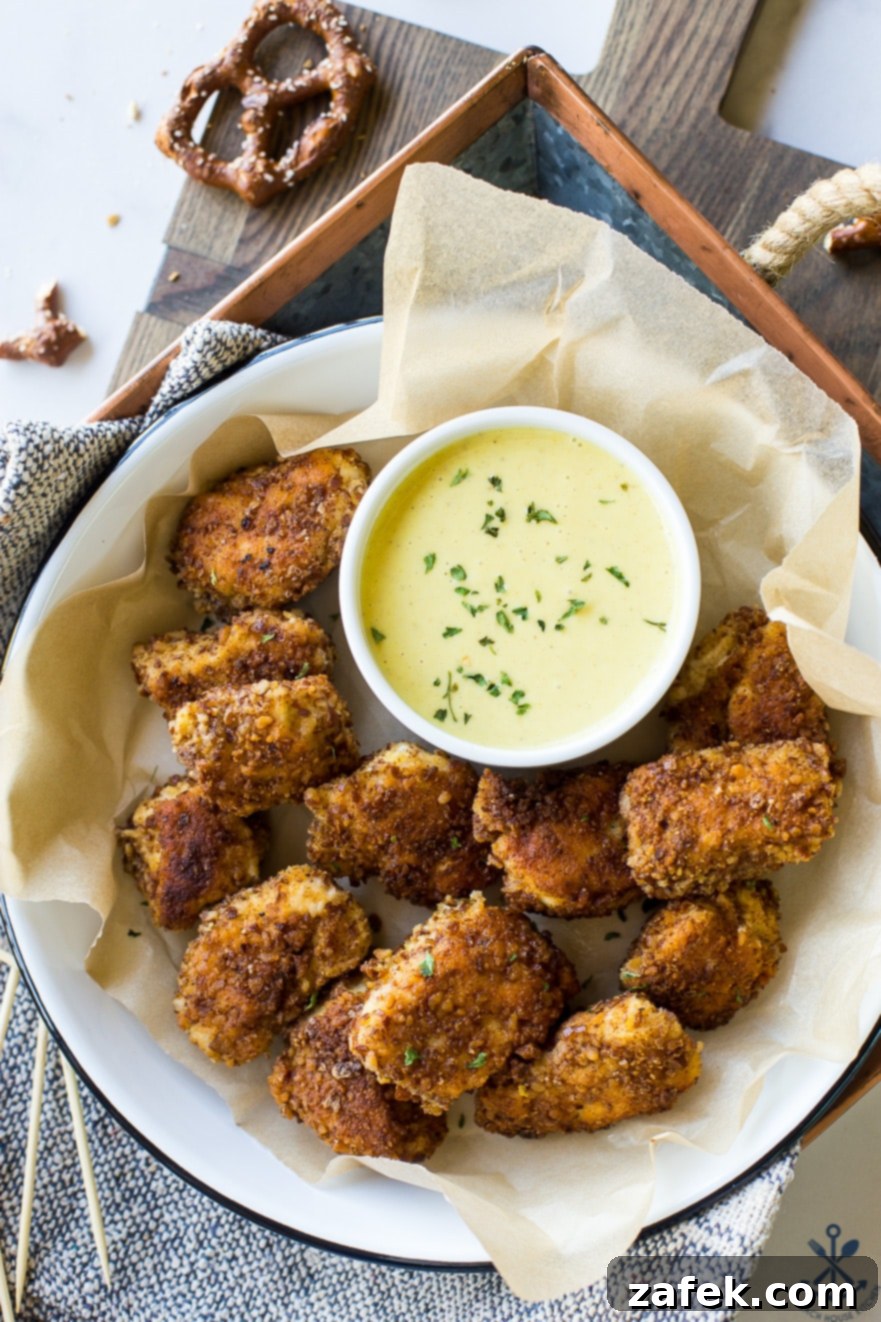 Crispy Pretzel Chicken Bites with Signature Mustard Sauce 2 Overhead photo of Pretzel Crusted Chicken Nuggets with Mustard Dipping Sauce
