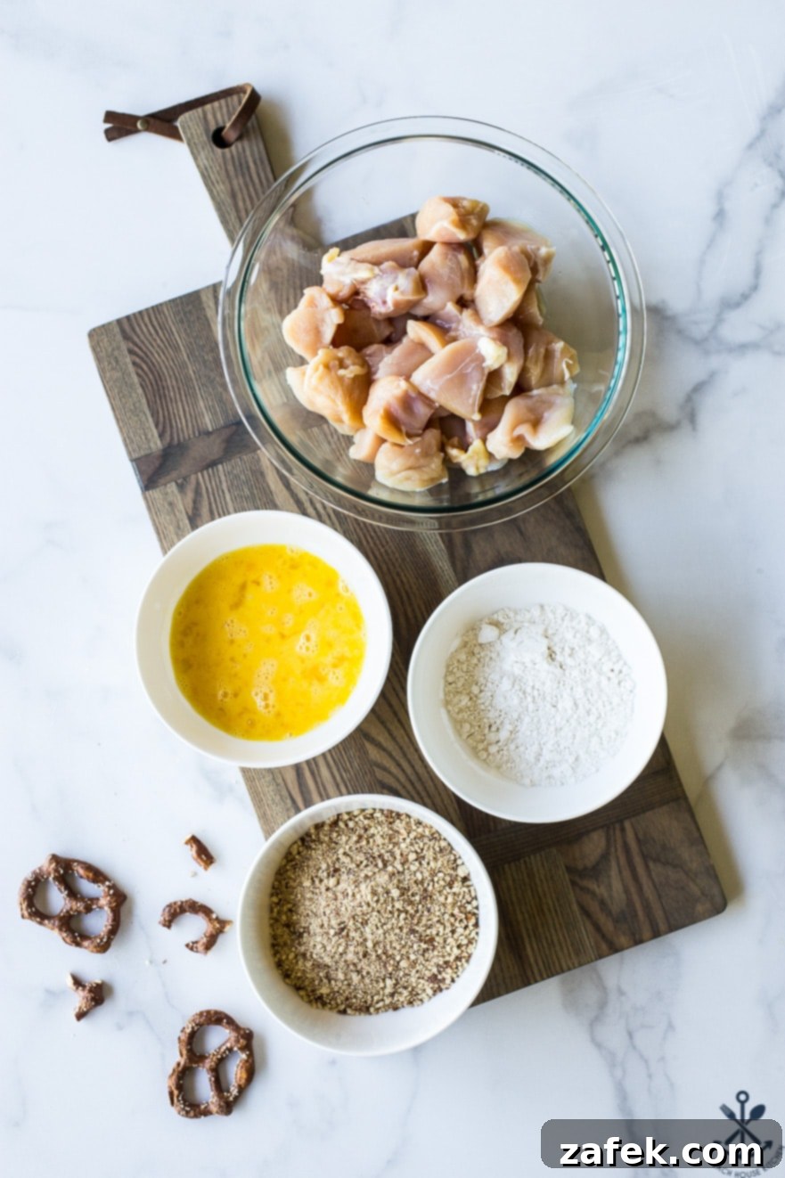 Crispy Pretzel Chicken Bites with Signature Mustard Sauce 5 Overhead photo of ingredients for pretzel coated chicken nuggets