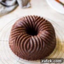 Zesty Chocolate Orange Bundt 11 Chocolate Orange Bundt Cake, garnished and ready to serve.