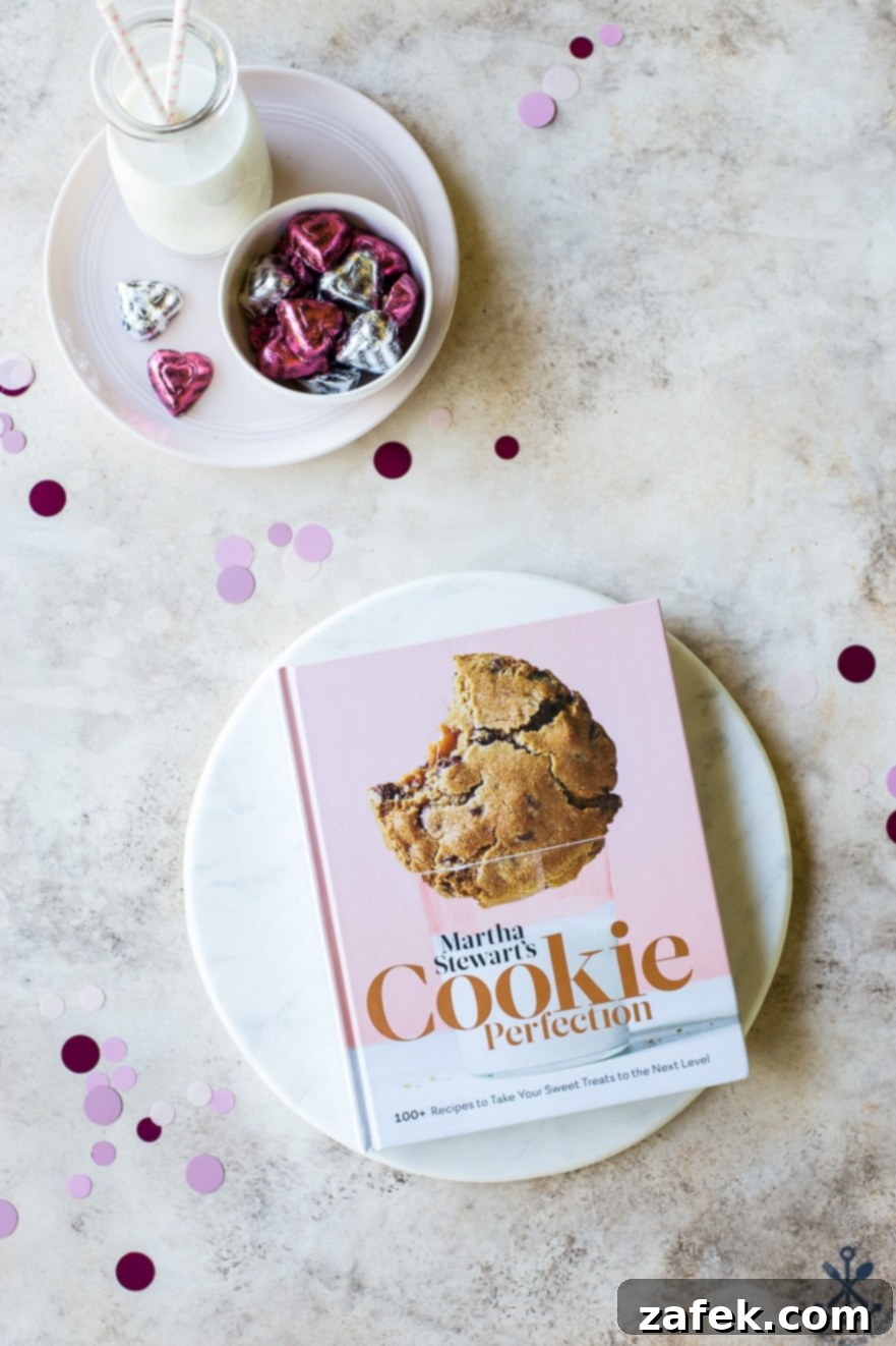 Brown Butter Honey Cardamom Delights 4 Martha Stewart's 'Cookie Perfection' cookbook resting elegantly on a round marble serving board, showcasing the source of inspiration for these unique Brown Butter Honey Cardamom Cookies.