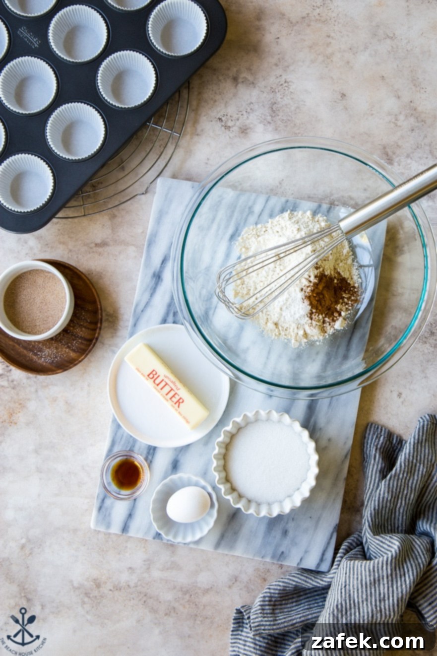 Spiced Snickerdoodle Cupcakes with Cinnamon Buttercream 8 Overhead photo of fresh ingredients for Snickerdoodle Cupcakes with Cinnamon Buttercream laid out on a marble board, ready for baking