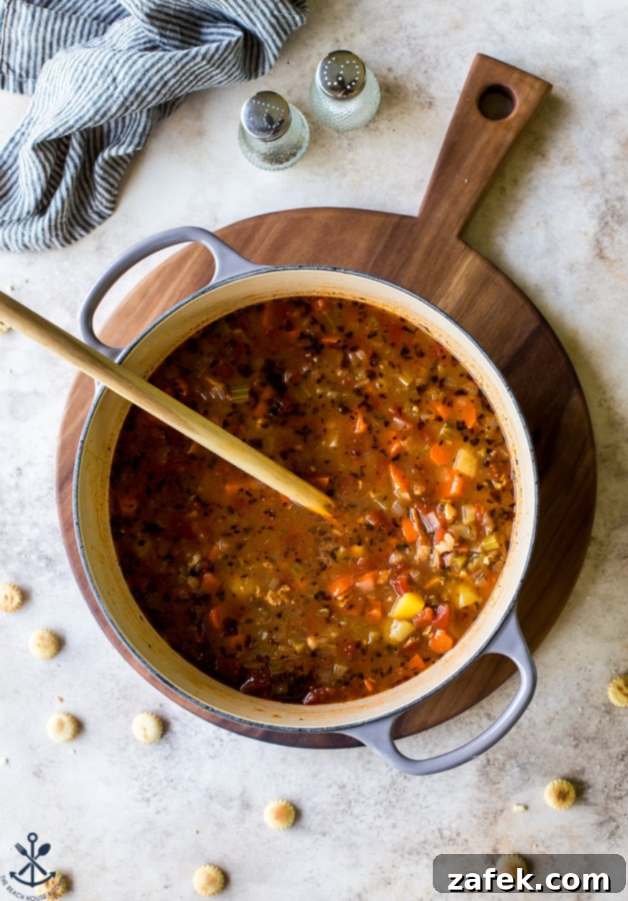 Manhattan's Red Clam Chowder 6 Overhead view of various fresh ingredients for Manhattan Clam Chowder, including chopped vegetables, herbs, and canned clams.