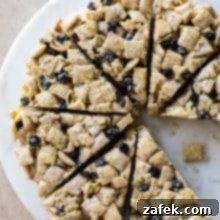 Blueberry Chex Crunch Bars 7 Overhead photo of wedges of blueberry Chex krispie treat on a round cake plate