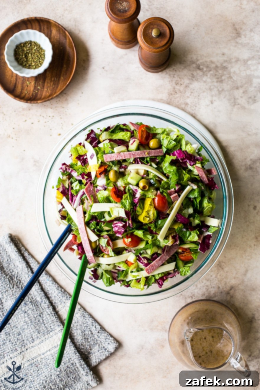 Close-up of the homemade lemon vinaigrette for Italian Chopped Salad in a small jar