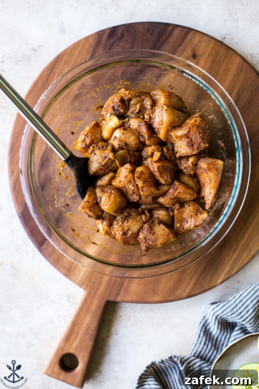 Fiesta Chicken Poppers 3 Close-up shot of perfectly cooked Mexican chicken bites in a skillet, showing the beautiful seasoning and tender texture