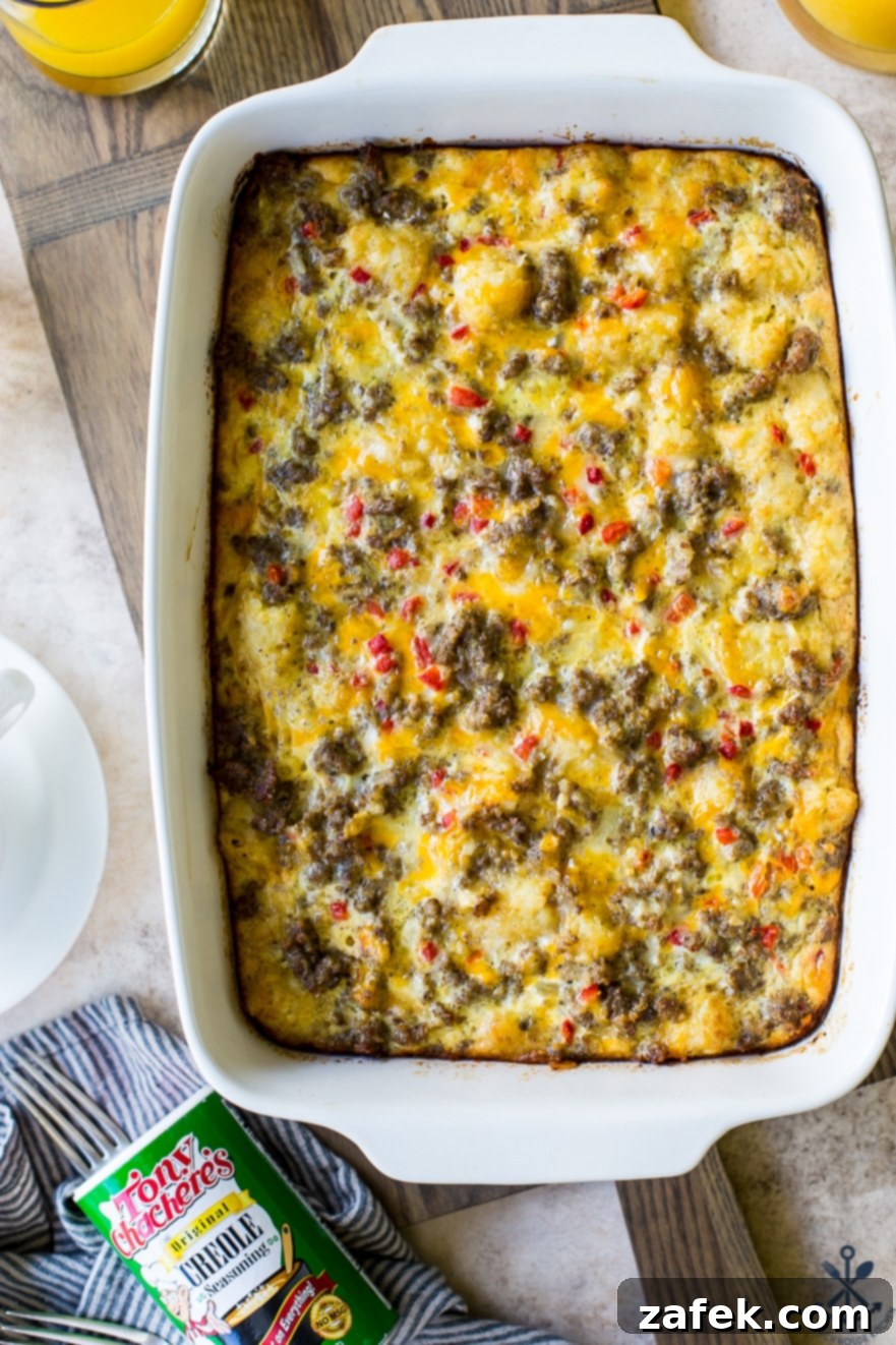 Creole Breakfast Casserole 9 Up close photo of Creole Breakfast Egg Bake with Sausage and Potatoes in a white baking dish