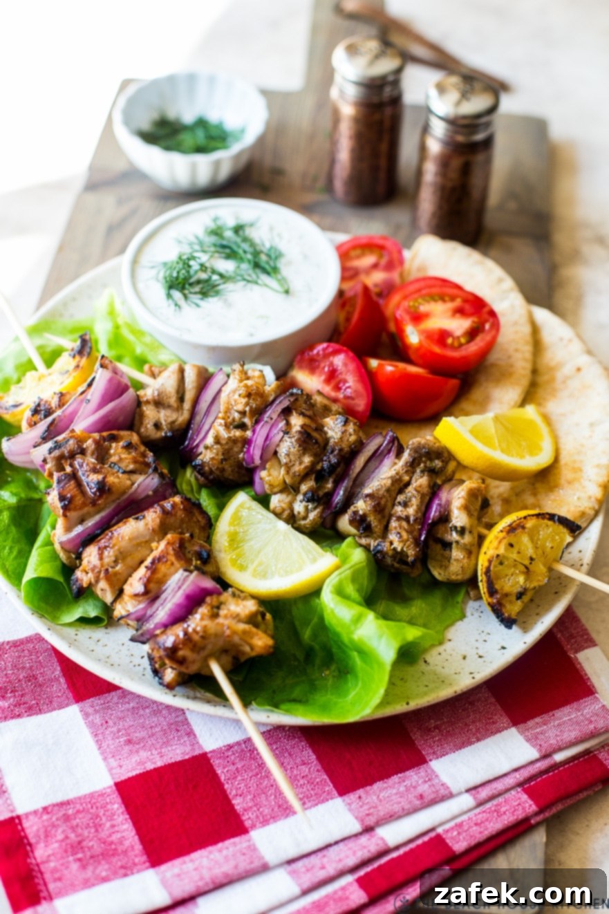 Chicken Souvlaki Skewers with Tzatziki Sauce on a plate