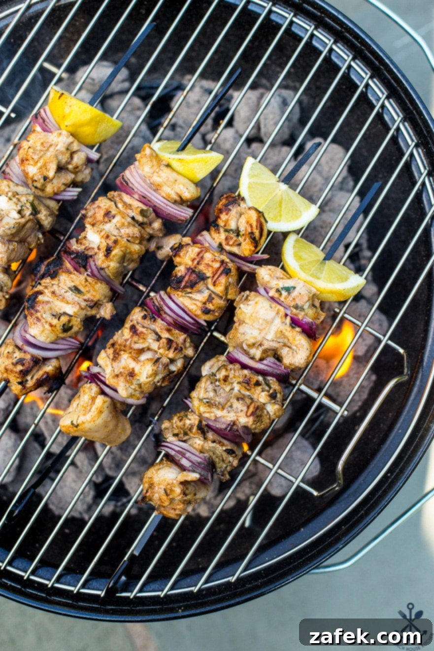 Chicken Souvlaki Skewers on a grill