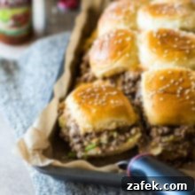 Tony's Baked Cheeseburger Sliders on a tray lined with parchment paper