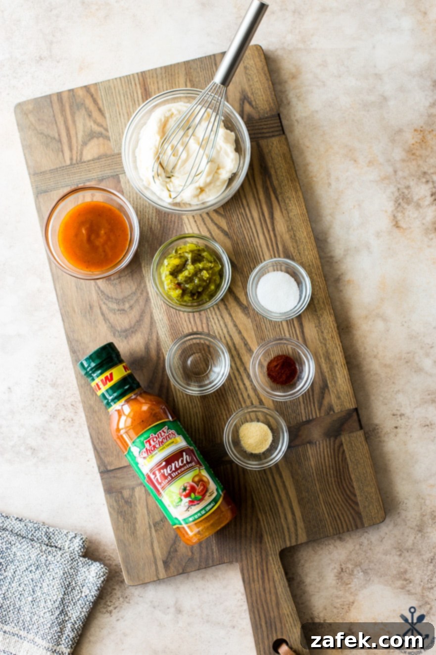 Overhead shot of individual ingredients for Tony's special sauce, including mayonnaise, Tony's French Dressing, and relish