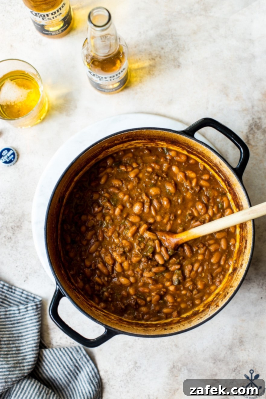 Overhead photo of pot filled with Mexican Baked Beans, ready to be served
