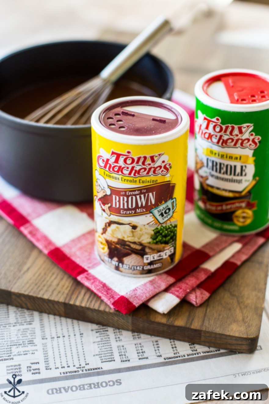 Bayou Poutine 6 Tony Chachere's brown gravy mix and creole seasoning cans on a wooden board