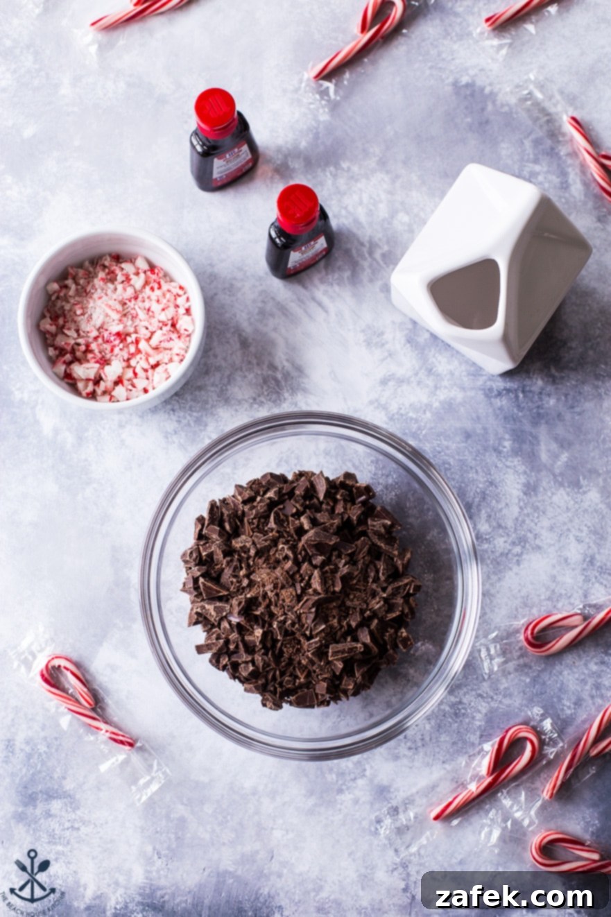 Peppermint Kissed Double Chocolate Decadence 7 Overhead photo of ingredients for chocolate peppermint ganache in bowls on a marble background