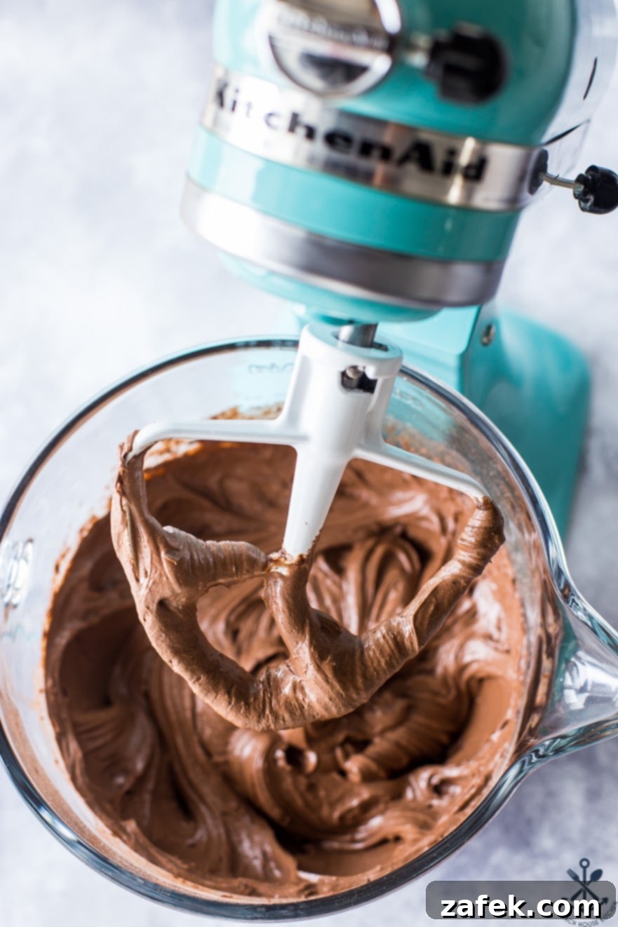 Peppermint Kissed Double Chocolate Decadence 10 Chocolate cake batter in a turquoise colored KitchenAid mixer