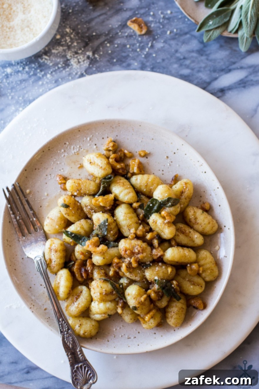 Sage-Kissed Gnocchi with Toasted Walnut Brown Butter 5 Up close overhead photo of plate of Gnocchi with Walnut Brown Butter Sage Sauce
