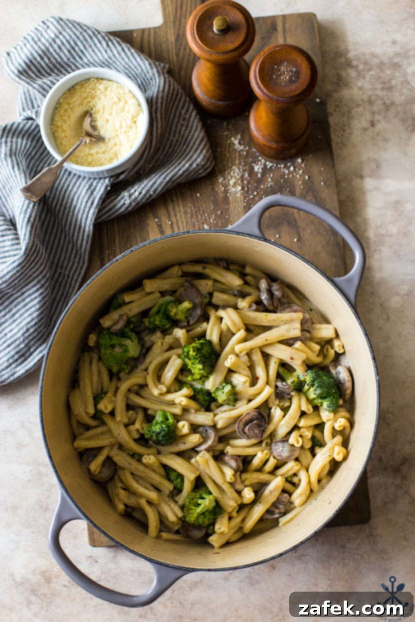 Creamy Garlic Pasta with Broccoli and Mushrooms 3 Overhead view of a large pot brimming with Creamy Garlic Broccoli Mushroom Pasta, ready to be served.