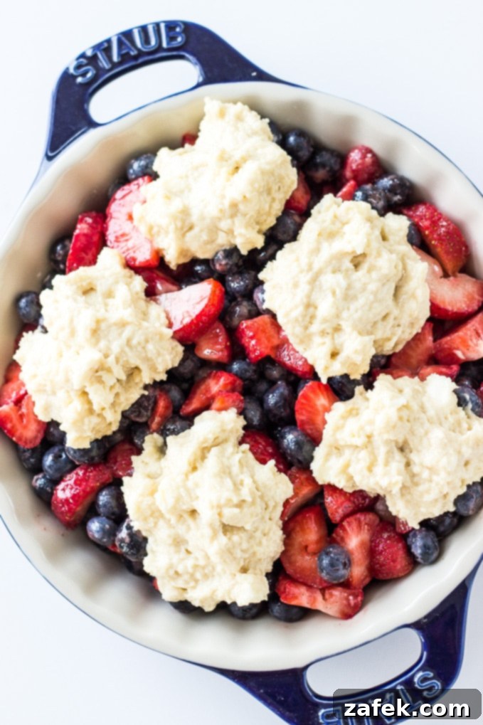 Sweet Biscuit Topping on Berry Cobbler, golden brown and inviting