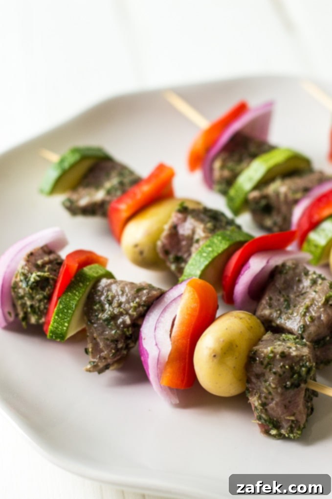 Assembled steak and veggie skewers before grilling