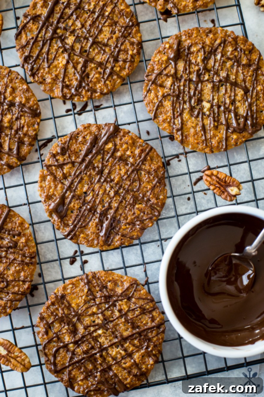 Overhead photos of freshly baked pecan coconut lace cookies cooling on a wire rack