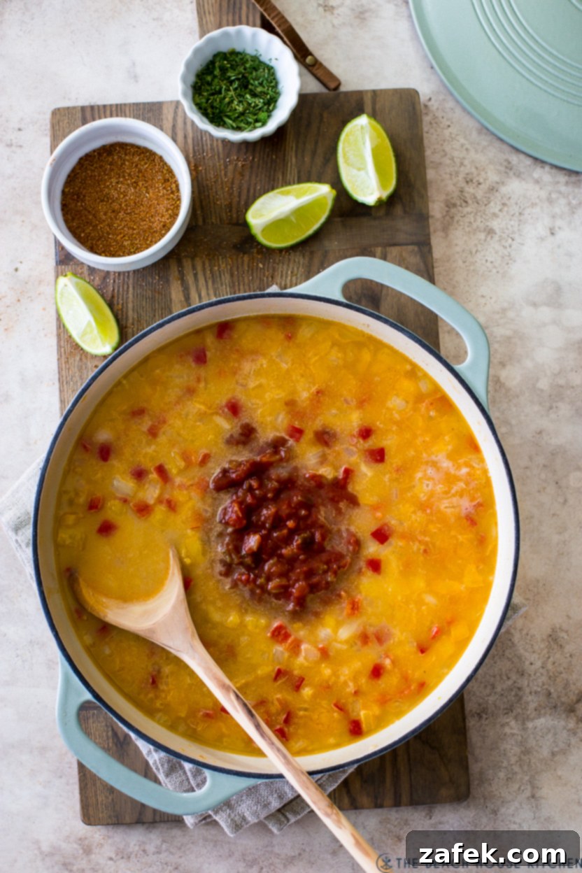 Overhead photo of a skillet of broth and veggies