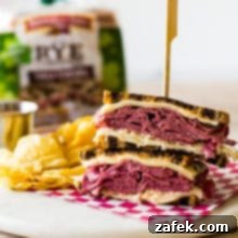 Classic Reuben Sandwich with chips and a loaf of rye bread in the background