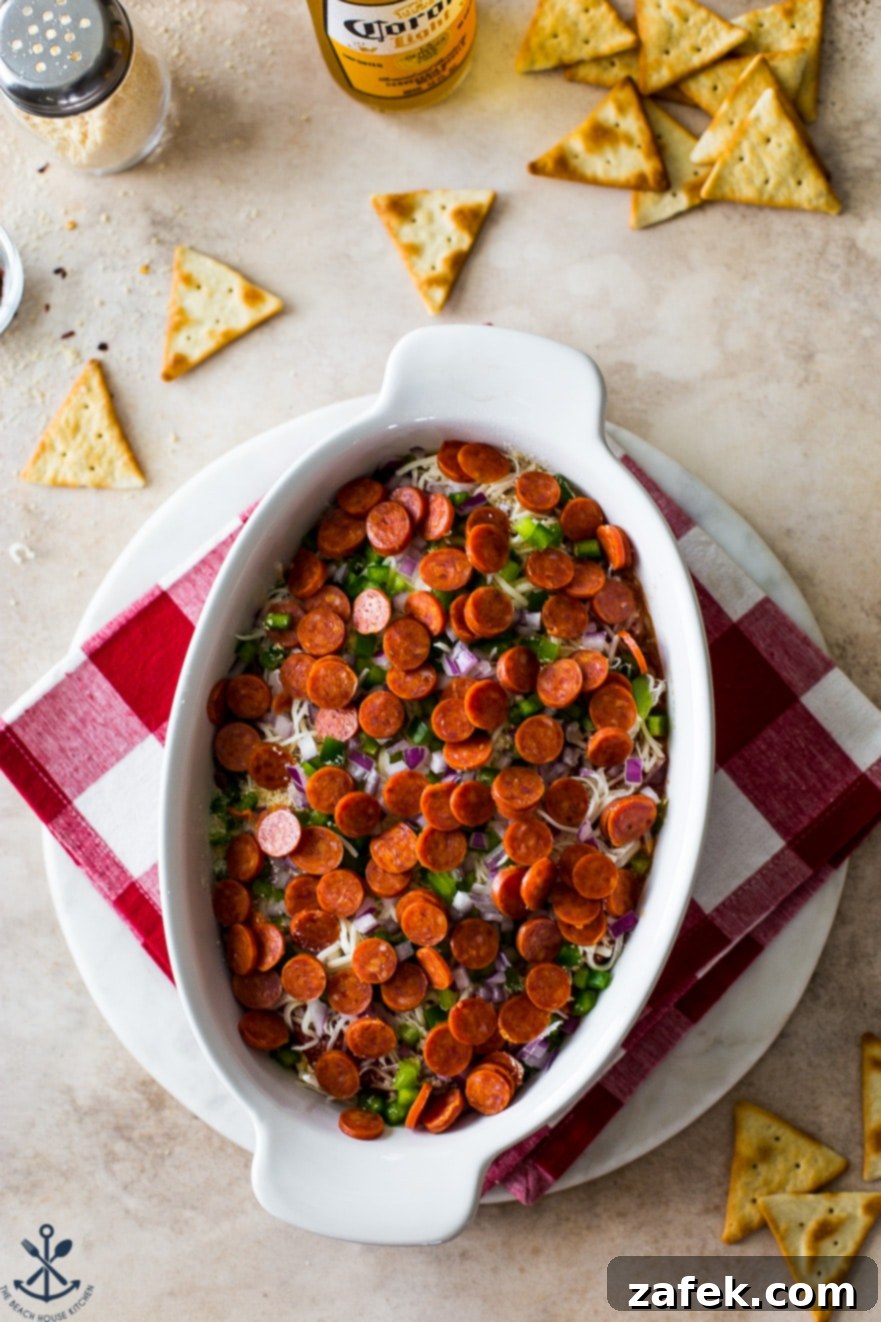 Overhead photo of the pre-baked pepperoni dip in a dish