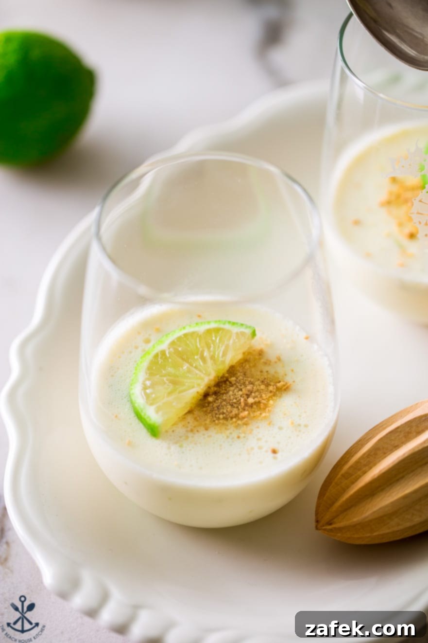 Zesty Key Lime Panna Cotta 3 A glass filled with panna cotta on a white plate
